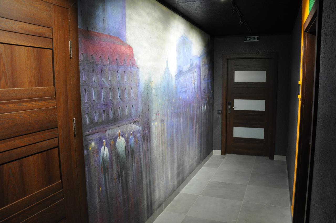 Full House Capsule Hostel Rivne Kültér fotó A wall mural in a hotel