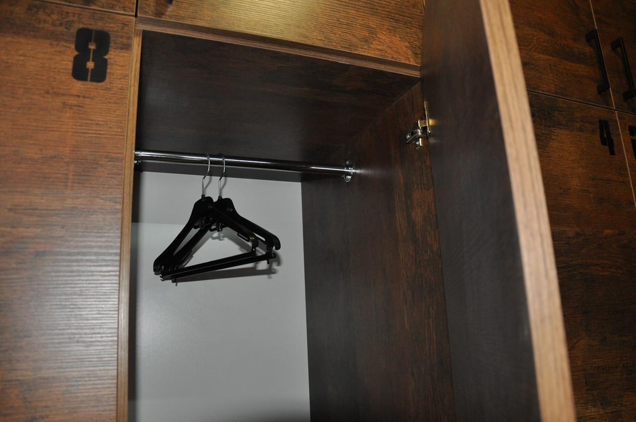 Full House Capsule Hostel Rivne Kültér fotó A coat hanger in a wardrobe