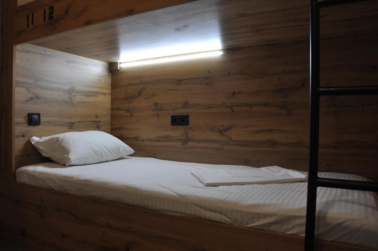 Full House Capsule Hostel Rivne Kültér fotó A bed in a hostel