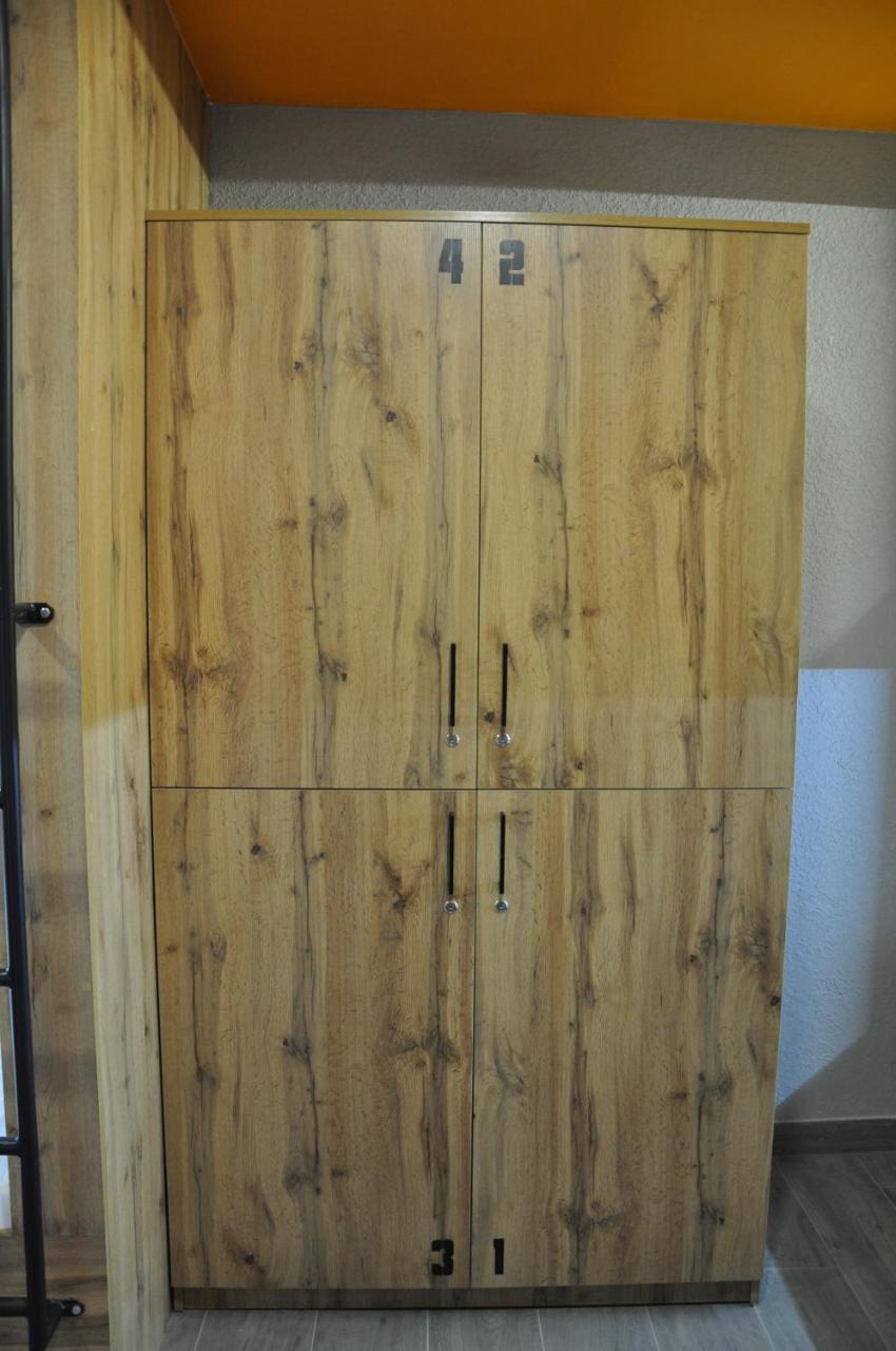 Full House Capsule Hostel Rivne Kültér fotó A wooden armoire